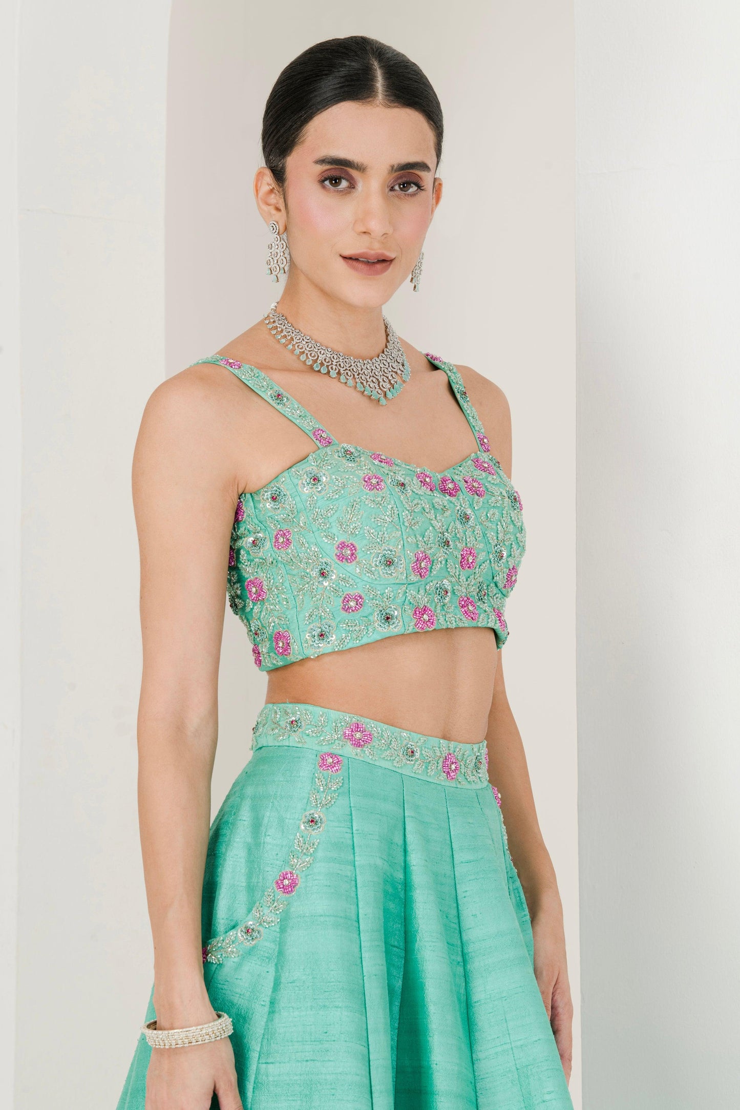 Designer Sea Green & Ruby Pink Hand Embroidered Raw Silk Lehenga for women side view